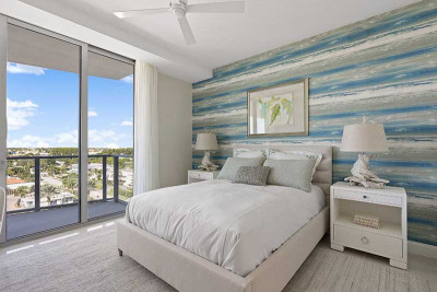 Model home bedroom with view of Singer Island and intracoastal