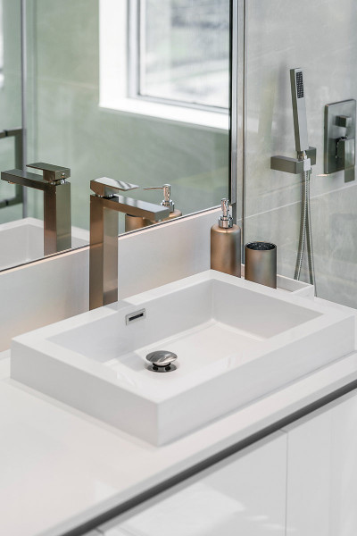 Luxury vanity complete with Eurpoean cabintery and quartz counters in Master bath